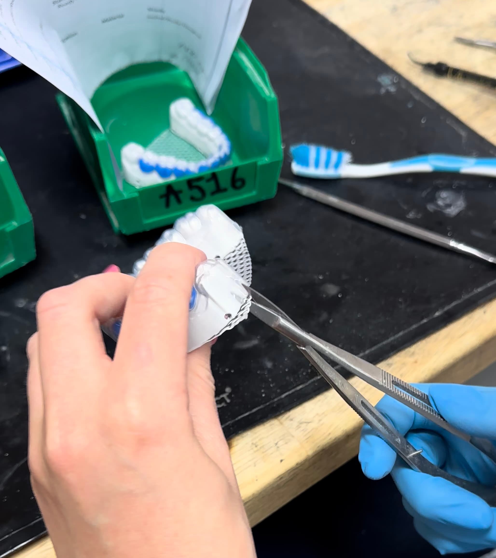 Tray being removed from vacuum formed sheet material